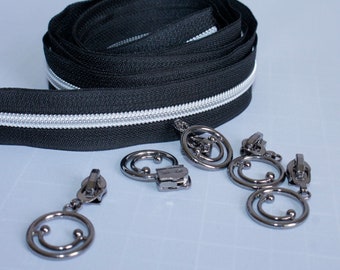 2.16EUR/m -  2,5m endlos Reißverschluss schwarz, metallisierte Zahnung, 5mm  + 5 Zipper Smiley altsilber
