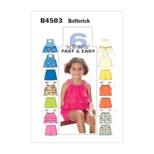 以下が含まれることがあります： Butterickのソーイングパターン、B4503。6つの子供用トップスとショーツを素早く簡単に縫うことができます。画像には、ピンクのフリル付きトップスとショーツを着た女の子が写っています。パターンには、さまざまなデザインのトップスとショーツが含まれています。