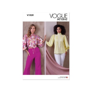 May include: Vogue Patterns V1939 sewing pattern featuring two women wearing blouses with puffed sleeves. The woman on the left is wearing a floral print blouse with a pink pair of pants. The woman on the right is wearing a yellow blouse with white pants.  Designed and printed in the USA.