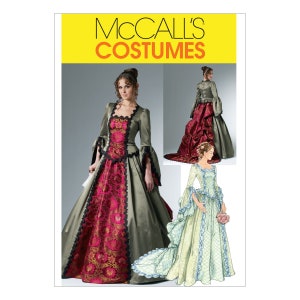 Può includere: Modello di cucito McCall's Costumes per un lungo abito verde e rosso con un bordo in pizzo. Il modello include due stili diversi di abito, uno con una gonna a balze e uno con una gonna più semplice.