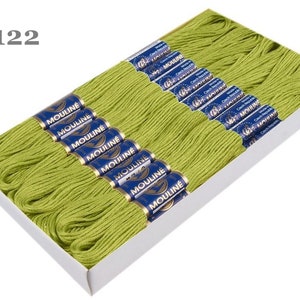 May include: A box of 6122 DMC Mouline embroidery floss in a bright green color. The floss is wound on spools with blue labels that say "Mouline" and "Czech Republic".