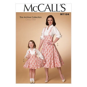 Peut inclure: Patron de couture McCall's M7184, The Archive Collection, Circa 1958, pour une robe à fleurs rouge et blanche avec un chemisier blanc. Le patron comprend deux tailles, une pour un enfant et une pour un adulte.
