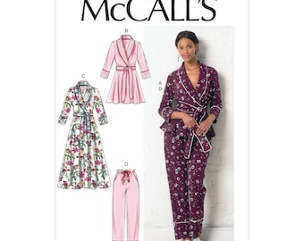 May include: A sewing pattern for a robe and pants. The pattern includes a long robe with a floral print, a short robe with a pink print, and a pair of pants with a floral print. The pattern is from McCall's and the pattern number is M7875.