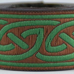 May include: Brown and green woven trim with a Celtic knot design.