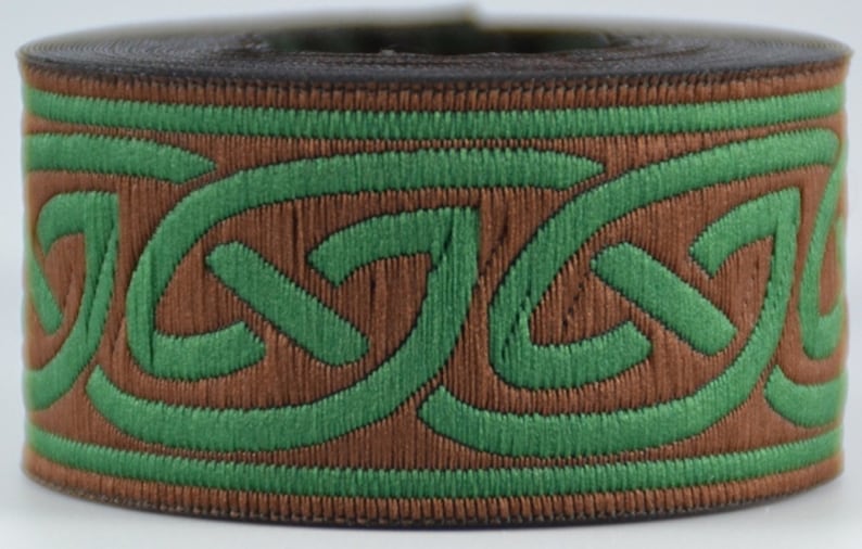 May include: Brown and green woven trim with a Celtic knot design.