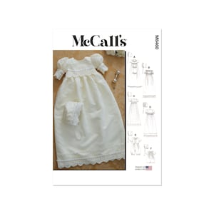 May include: A McCall's pattern featuring a baby's christening gown and bonnet. The white gown has a scalloped lace trim and puff sleeves. The bonnet has a matching lace trim. The pattern also includes other baby garment designs.