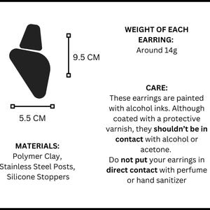 May include: A black silhouette of an earring measuring 9.5 cm by 5.5 cm. Text details include: WEIGHT OF EACH EARRING: Around 14g. MATERIALS: Polymer Clay, Stainless Steel Posts, Silicone Stoppers. CARE: Painted with alcohol inks, avoid alcohol or acetone.