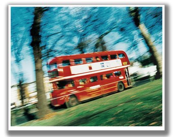 Old Routemaster London Bus (route 35), travelling across Clapham Common in London, with motion blur.