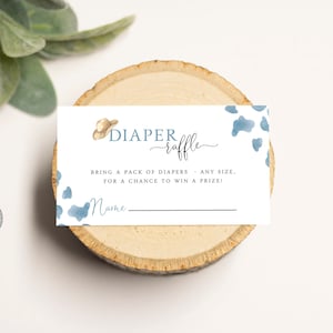 May include: A white card with blue watercolour spots and a cowboy hat graphic. The text reads "DIAPER raffle" and "BRING A PACK OF DIAPERS - ANY SIZE, FOR A CHANCE TO WIN A PRIZE!" with a line for a name.