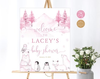 May include: Pink and white baby shower welcome sign with a watercolor mountain and forest scene. The sign says "Welcome to Lacey's Baby Shower" with the date January 15, 2023. The sign features a polar bear, owl, penguins, and a fox.