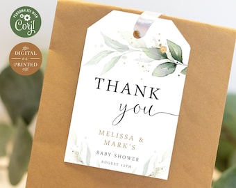 May include: White thank you tag with green watercolor leaves and gold glitter accents. The text reads "Thank you" with the names "Melissa & Mark's" and "Baby Shower" below. The date "August 12th" is printed at the bottom.