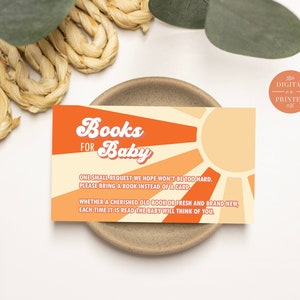 May include: A digital printable card with an orange and yellow sunburst design. The text reads "Books for Baby" with a request to bring a book instead of a card to a baby shower.