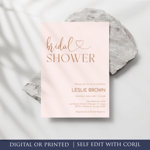 May include: A pink bridal shower invitation with a gold script font that says "bridal shower". The invitation includes the bride's name, the date, time, location, and RSVP information.