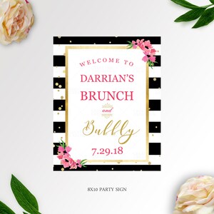 May include: Black and white striped party sign with gold glitter and pink flowers. The sign says "Welcome to Darrian's Brunch and Bubbly 7.29.18" and "8x10 Party Sign".