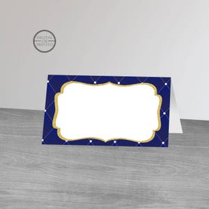 May include: Navy blue place card with a gold glitter frame and white polka dots. The frame has a blank space for writing a name.