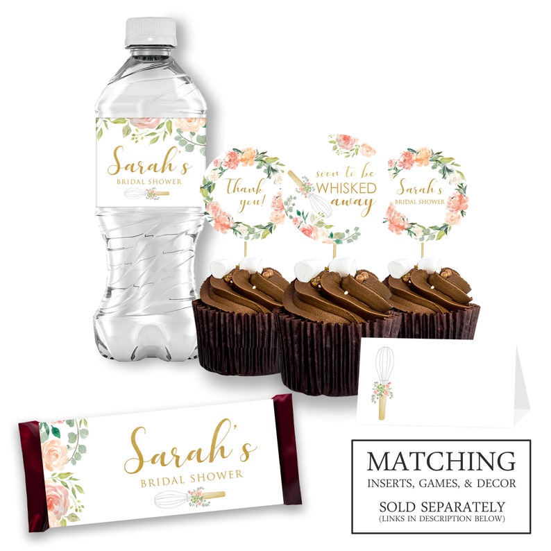 May include: A set of bridal shower party decorations featuring a floral and gold design with the name "Sarah's" and the text "Bridal Shower". The set includes a water bottle label, cupcake toppers, a chocolate bar wrapper, and place cards.