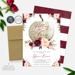 May include: A white pumpkin with the words "falling in love" written in calligraphy. The pumpkin is surrounded by burgundy and blush pink flowers. The text "Please join us for a bridal shower honoring Genie Lorne" is at the bottom of the invitation. The invitation is decorated with a watercolor floral design.