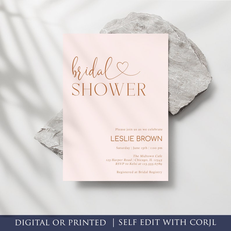 May include: A pink bridal shower invitation with a gold script font that says "bridal shower". The invitation includes the bride's name, the date, time, location, and RSVP information.