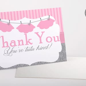 May include: Pink and gray thank you card with a line of pink tutus hanging on a clothesline. The card says "Thank You You're tutu kind!"