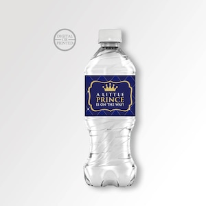 May include: A blue and gold water bottle label with a crown and the text "A Little Prince Is On The Way!"