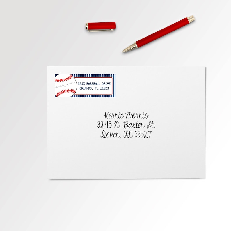 May include: A white envelope with a blue and red baseball-themed address label. The label has a baseball graphic and the text "2543 BASEBALL DRIVE ORLANDO, FL 11223". The envelope also has handwritten text: "Kerrie Morris 32.45 N. Baxter St. Dover, FL 33527"