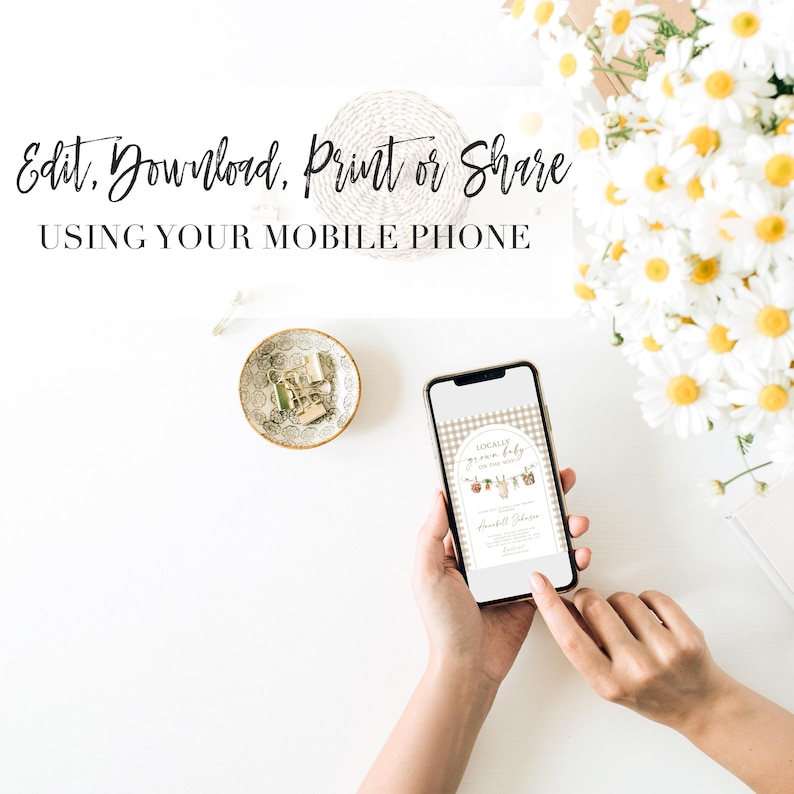 May include: A smartphone displaying a printable baby shower invitation with a brown and white gingham background. The invitation features a banner with the text "Locally Grown Baby" and a line of baby clothes hanging on a clothesline. The text "Edit, Download, Print or Share Using Your Mobile Phone" is displayed above the phone.