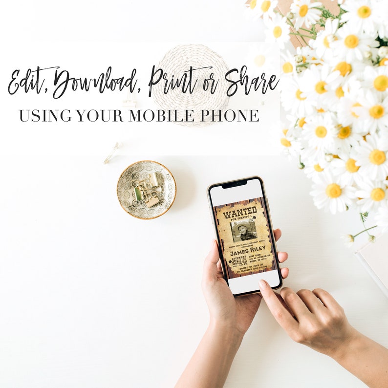 May include: A smartphone displaying a printable "Wanted" poster with a photo of a young boy wearing a cowboy hat. The poster text reads "Wanted for Turning 4". The text on the phone screen reads "Edit, Download, Print or Share Using Your Mobile Phone".