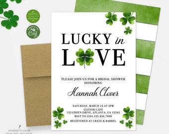 May include: A bridal shower invitation with the text "LUCKY in LOVE" and shamrock accents. The invitation includes details for the event, such as the date, time, and location. A kraft paper envelope and a green and white striped backing are also visible.