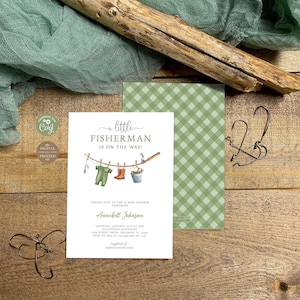 May include: A white baby shower invitation card with the text A little FISHERMAN IS ON THE WAY! featuring a watercolor illustration of a fishing line with a green onesie, brown boots, and a bucket. The card includes event details for Annabell Johnson.