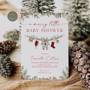 May include: A white baby shower invitation card featuring red text that reads a merry little BABY SHOWER, honoring Samantha Collins, Saturday, December 15th at 3pm, North Pole Cafe, 1234 Street Drive, Orlando, FL 12345, RSVP to Ann at 123.456.7890 by 12/10.