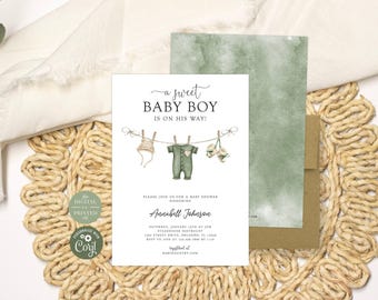 May include: A white baby shower invitation card featuring the text A SWEET BABY BOY IS ON HIS WAY, with an illustration of a clothesline holding a bonnet, a green onesie, and booties. Below is text for Annabell Johnson, date, time, and location.