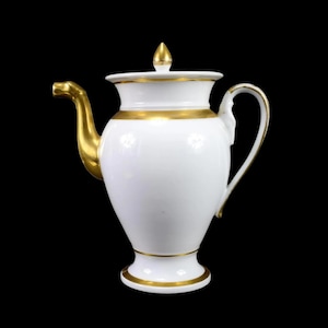 May include: White porcelain teapot with a gold trim and a gold handle. The teapot has a round body and a tall, slender spout.