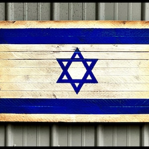 Flag of Israel and text SHABBAT SHALOM on wooden background Stock Photo