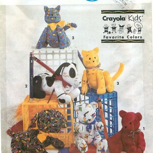 May include: Simplicity Crafts pattern featuring various stuffed animal designs, including a blue cat, a black and white dog, a yellow cat, a red bear, and a white bear. The pattern includes Crayola Kids' Favorite Colors.