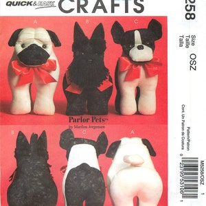 May include: McCall's Crafts M5258 sewing pattern for Parlor Pets by Marilou Jorgensen. The package features illustrations of three stuffed dog toys: a pug, a black terrier, and a French bulldog, each shown from front and back views.
