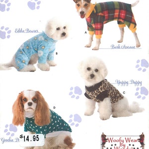 May include: A Simplicity sewing pattern envelope 3939 for dog clothing featuring four designs: a plaid jumpsuit, a blue floral jumpsuit, a leopard print vest, and a green heart-patterned shirt. The cover displays dogs wearing these garments.