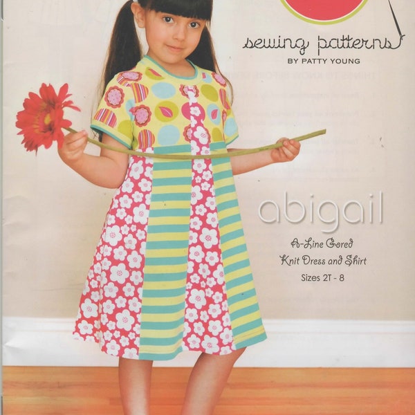 Modkid Sewing Pattern for "Abigail", an A Line Gored Knit Dress and Shirt, Girl's Sizes 2T - 8.