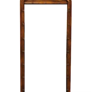 May include: A tall, rectangular mirror with a brown wooden frame. The frame has a decorative, woven pattern at the top.
