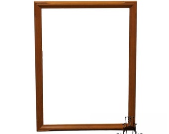 May include: A simple, rectangular wooden picture frame with a light brown finish.