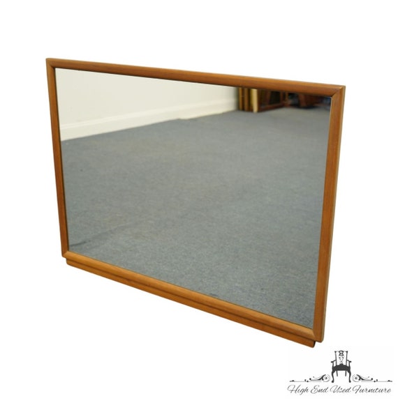 Cavalier dresser with mirror outlet
