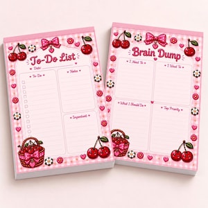 May include: Two rectangular paper notepads with a pink gingham border. The left notepad is titled To-Do List and includes sections for date, tasks, notes, and important items. The right notepad is titled Brain Dump with sections for I Need To, I Want To, What I Should Do, and Top Priority. Both feature cherry and bow illustrations.