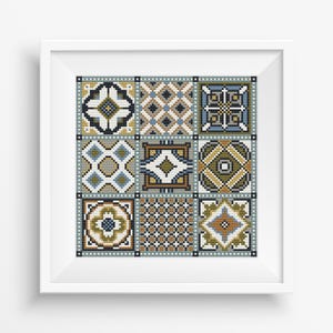 May include: A cross-stitch pattern featuring nine different geometric designs in shades of blue, green, brown, and white. The designs are arranged in a grid pattern.