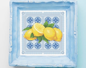 May include: A cross-stitch pattern featuring a blue and white tiled background with a cluster of yellow lemons and green leaves.