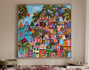 May include: A square wall art print featuring a vibrant coastal scene with colorful Mediterranean-style buildings, lush palm trees, and sailboats on a bright blue sea. The painting uses a bold palette of red, orange, yellow, and green.