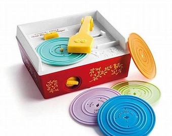 Recent Fisher Price RECORD PLAYER including 4 differents recordsin working condition