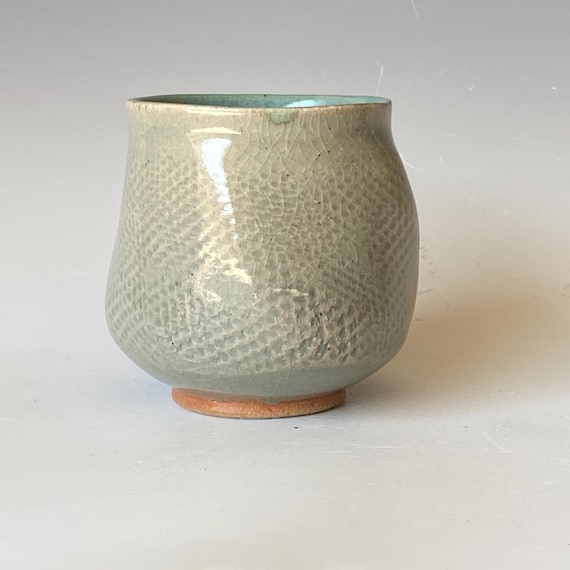 Handmade Ceramic Tea Cup: Twisted Design