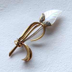 Mother-of-pearl leaf brooch with gold tone metal flower stem, vintage 50s 60s