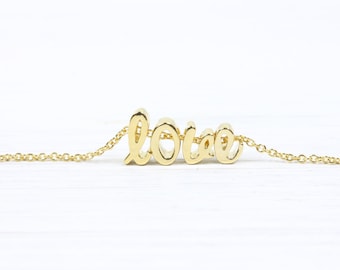 Armband med initialer i guld: Smycken med skrivstilsmotiv