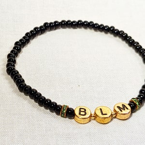 Black Lives Matter Stretch Bracelet with Gold Letters