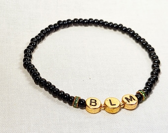 Black Lives Matter Stretch Bracelet with Gold Letters